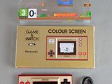 a nintendo game console and a nintendo game controller next to each other