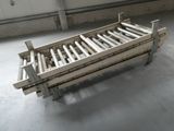 a bed that is made out of wood in a room