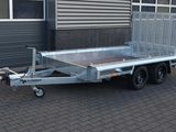 a trailer that is parked in front of a building