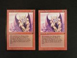 two cards of a card game with a picture of a demon and a demon