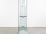 an image of a glass display case with a mouse on the floor