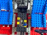 a close up of a lego train with a red, white and blue background