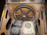 an old machine that is sitting on the ground