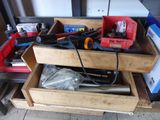 a drawer full of tools on a workbench