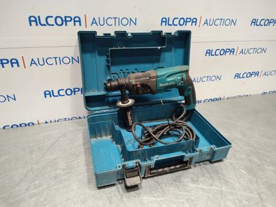 a blue tool box with a drill and a cord in it