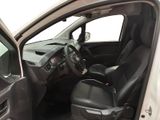 the interior of a car with the door open and the driver ' s seat down