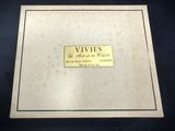 an old book with a gold plate on the cover