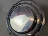 a silver plate that is sitting on a table