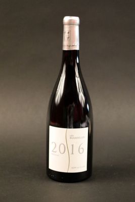 a bottle of wine that is sitting on a table