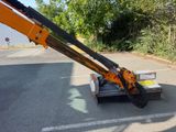 a crane that is sitting in the middle of a parking lot