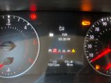 a close up of a car dashboard with various gauges and numbers