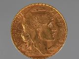 an image of a gold coin with a woman ' s head on it