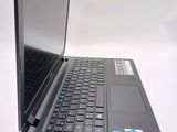 a black laptop computer sitting on top of a white table