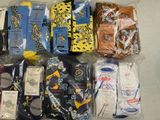 several pairs of men ' s socks in plastic bags on a table