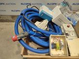 a box with a bunch of blue hoses and a box of wires