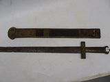 pair of antique brass swords with black and gold decoration