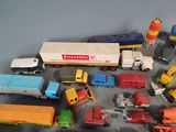 a lot of toy trucks that are sitting on a table