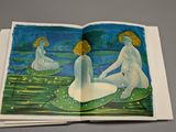 a picture of a book with a picture of two women in the water