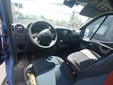 a view of the inside of a car from the driver ' s seat