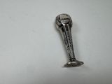 a silver spoon that is sitting on a table