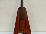 a violin that is sitting on a white table