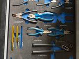 many different tools in this box on the table