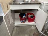 a sink and a washer in a small room