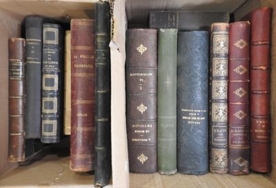 many old books on a shelf in a book case