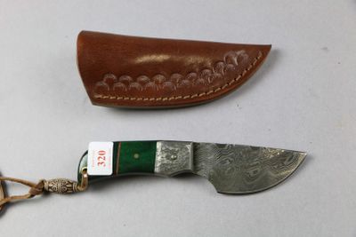 two different types of knives on a table