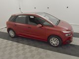 a picture of a red minivan parked in a garage