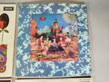 three beatles albums are sitting on a white surface