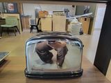 a toaster with a picture of a dog inside of it