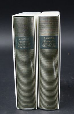 pair of two books sitting on top of each other on a table