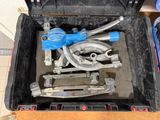 a tool box with tools in it sitting on the floor
