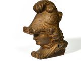 statue of a man with a goat ' s head on a white background