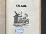an old book with a picture of a train coming out of it