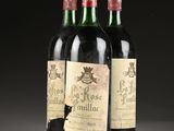 three bottles of wine sitting on top of a table next to each other