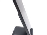 a cell phone on a stand on a white surface