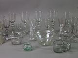 a lot of glass vases that are sitting on a table
