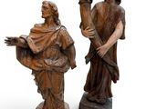 statue of a man and a woman holding flowers on a white background