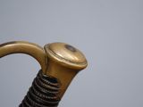 a close up view of an old fashioned umbrella handle