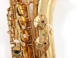 an image of a gold saxophone on a white background