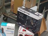 many boxes on the floor next to a shopping cart