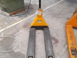 a forklift sitting on the ground in a warehouse