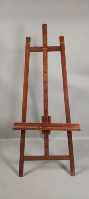 a wooden easel with a wooden seat on a white background