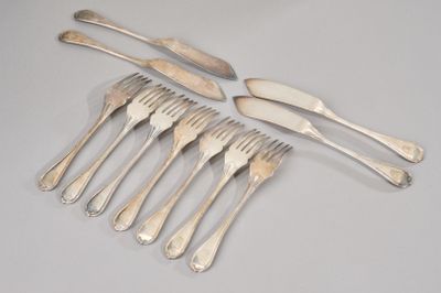 six forks and a knife on a table with a white background