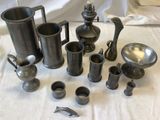 many different types of pewware sitting on a table