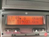 a digital clock on the dashboard of a car