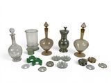 a lot of glass and metal items on a white surface