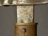a close up of a sword with a gold handle